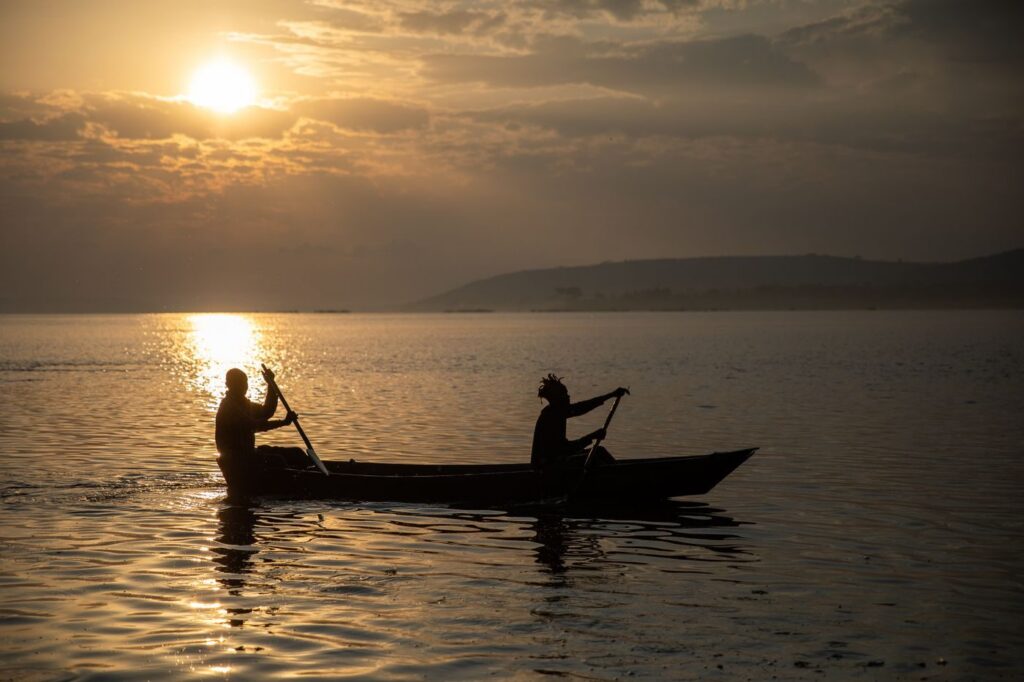 Two canoeists at sunset on Lake Victoria near Jinja