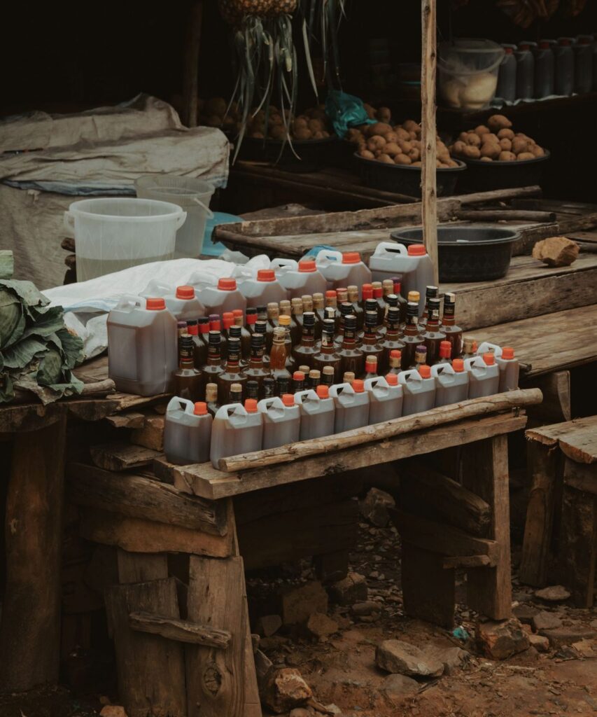 Small grocery stall with goods on wooden shelves