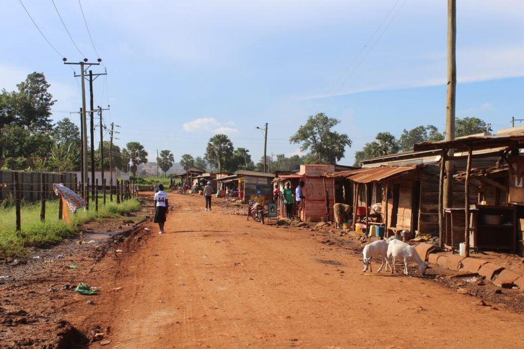 Market street lined with small shops in Jinja