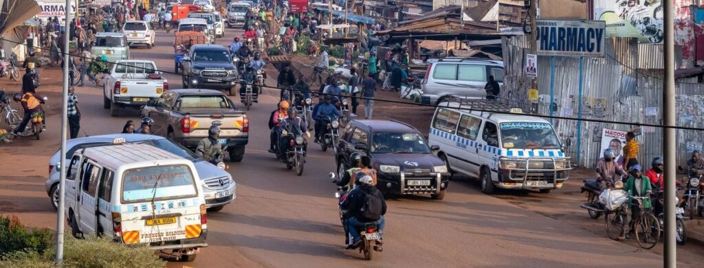 Traffic and pedestrians on a main road in Kampala