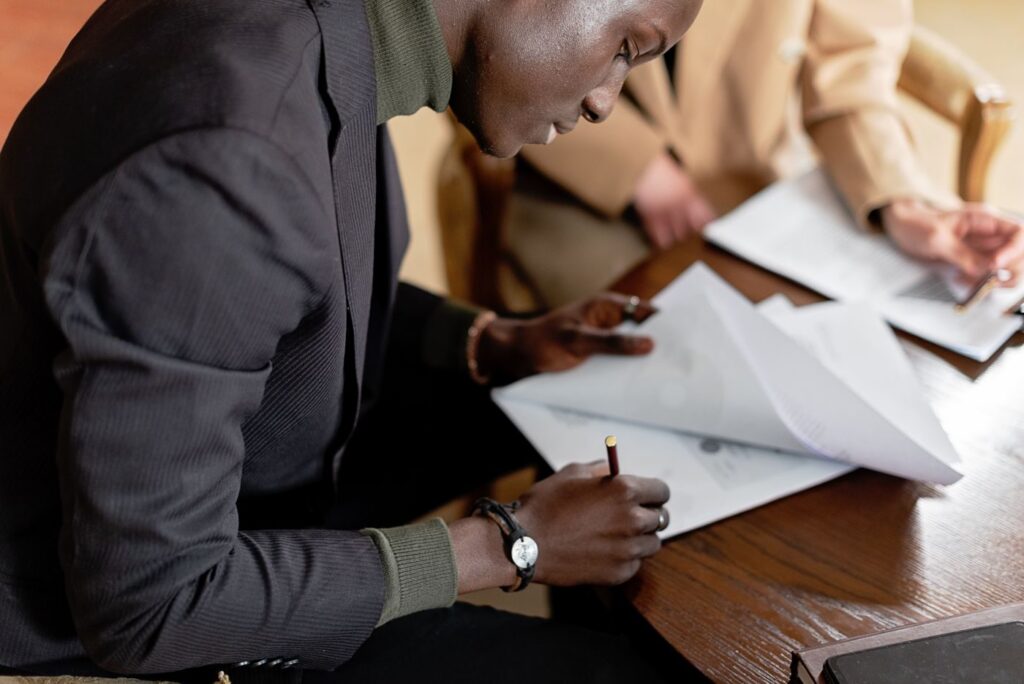 Businessman signing documents at a desk